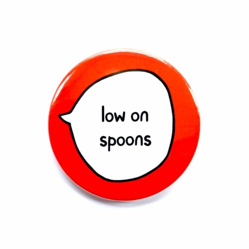 'low on spoons' pin badge with red background