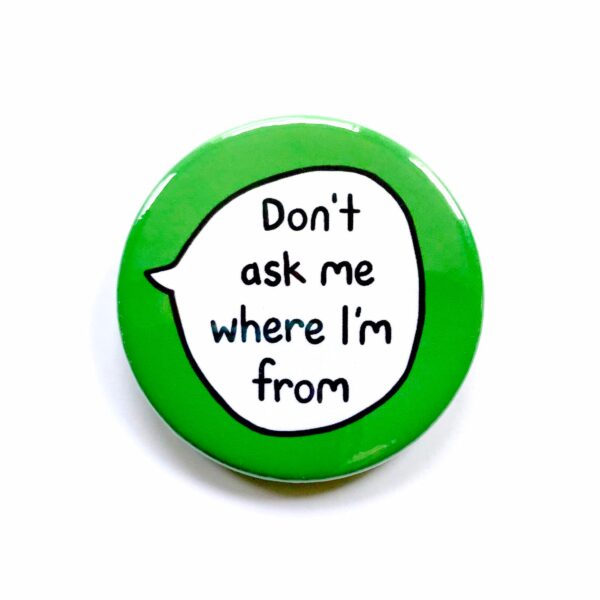 'Don't ask me where I'm from' pin badge with green background