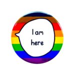 'I am here' badge with pride flag background